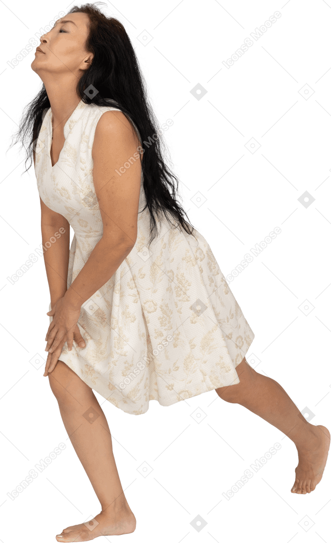 Woman in beautiful dress exercising