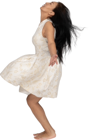 Woman in beautiful dress jumping