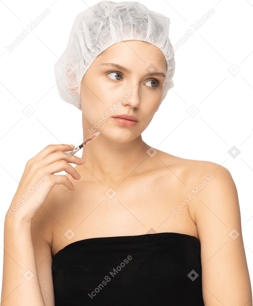 Mujer joven, con, jeringa, cerca, ella, cara